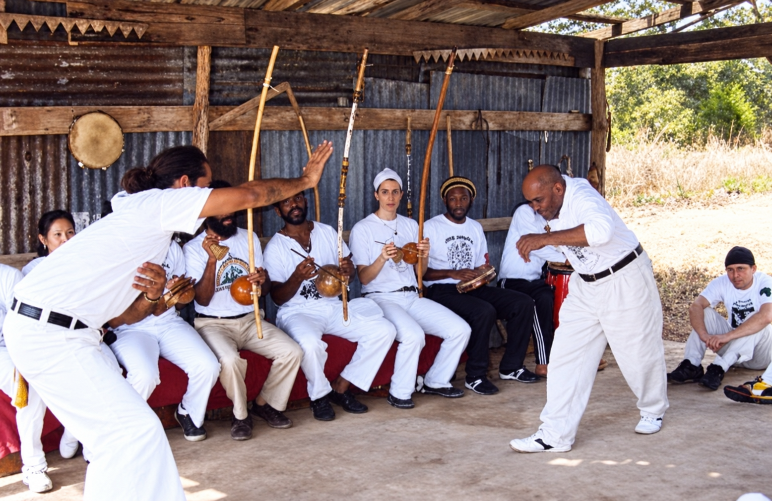 Flyer for Crianças de Capoeira Angola Academy showing an outdoor roda with musicians and practitioners in white