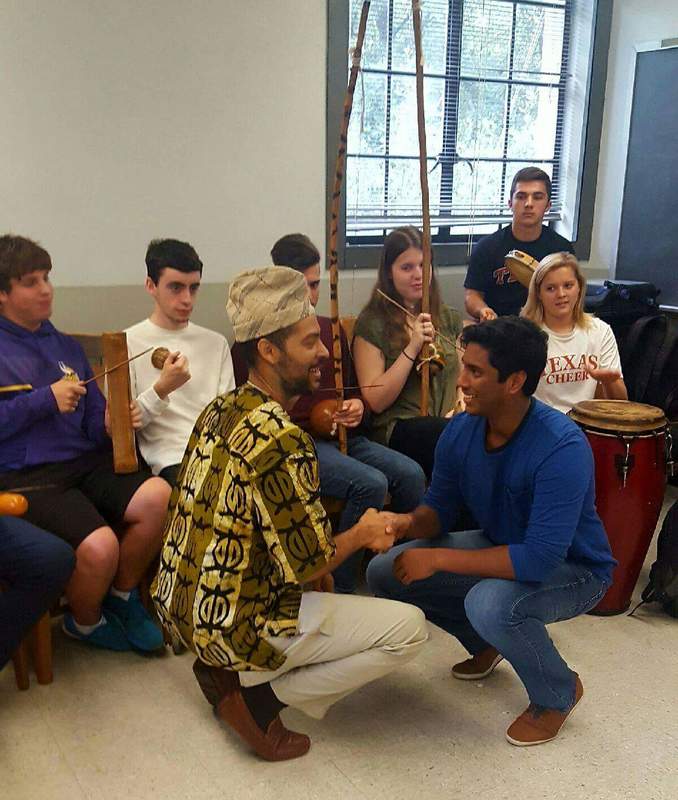 Awó, Bàbá Èṣùdámiláre teaching a circle of students with instruments